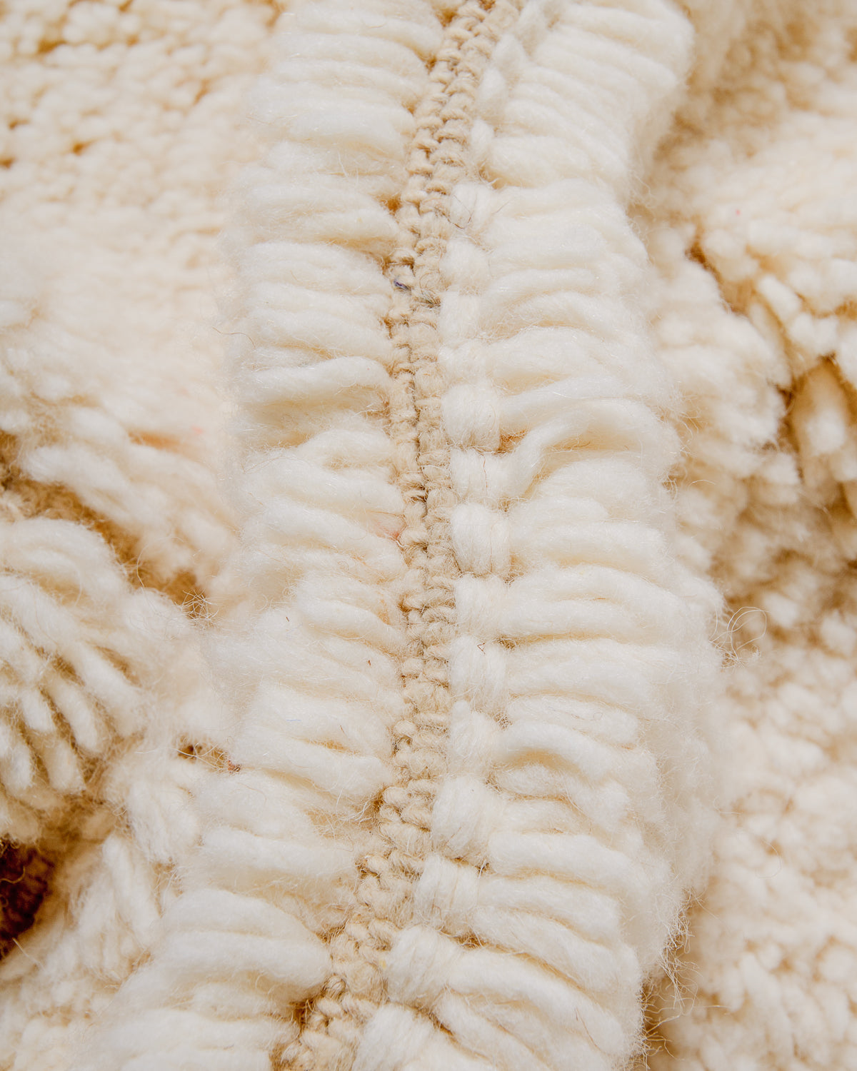 Detail of wool texture of Berberlin beniourain rug.